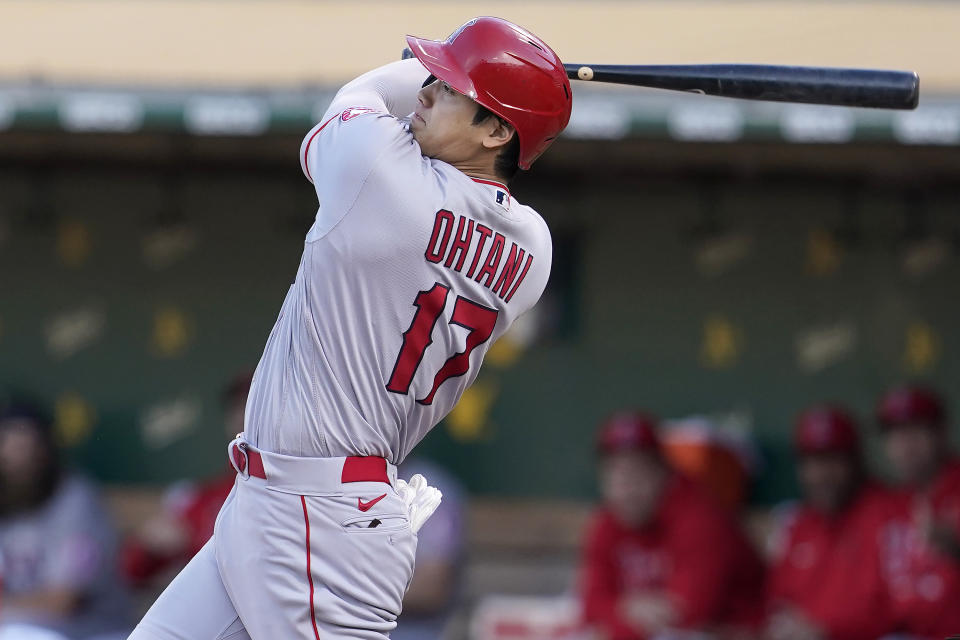 Los Angeles Angels' Shohei Ohtani hits a double against the Oakland Athletics during the third inning of a baseball game in Oakland, Calif., Monday, July 19, 2021. (AP Photo/Jeff Chiu)