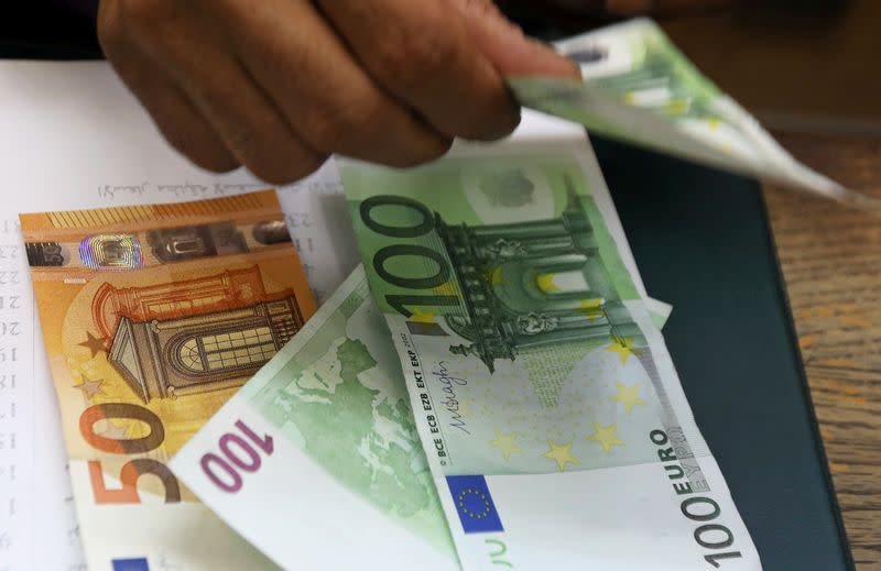 FILE PHOTO: An employee counts Euro bills at a money exchange office in central Cairo