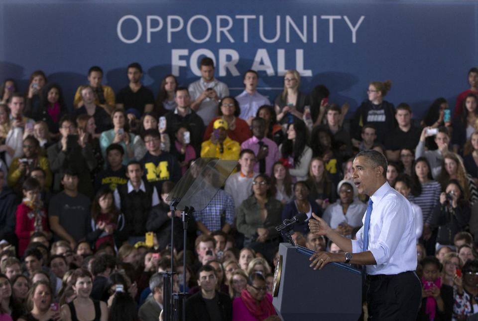 President Barack Obama speaks at the University of Michigan, Wednesday, April 2, 2014, in Ann Arbor, Mich., about his proposal to raise the national minimum wage. (AP Photo/Carolyn Kaster)