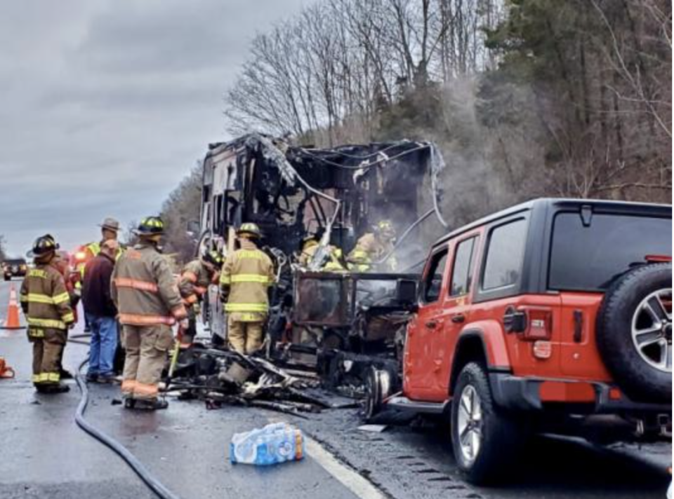 Emergency fire workers douse a burning motorhome in upstate New York. / Credit: New York State Troopers