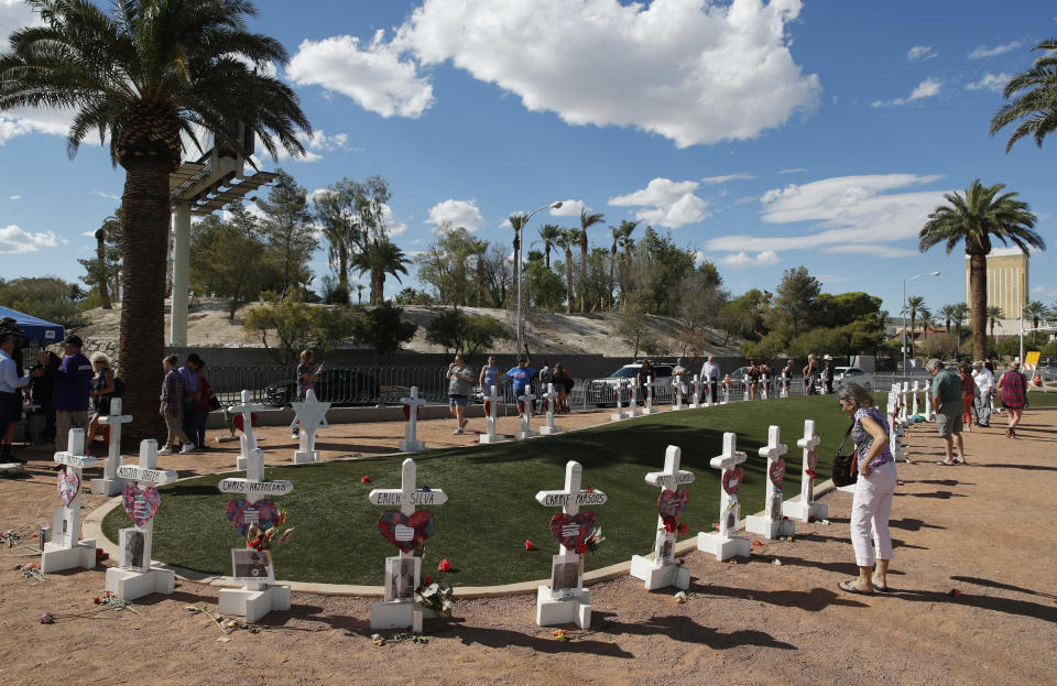 FILE - People visit a makeshift memorial for victims of the Oct. 1, 2017, mass shooting in Las Vegas, Sunday, Sept. 30, 2018, in Las Vegas. Families of people killed in the Las Vegas Strip massacre in October 2017 will receive shares of almost all the $1.4 million estate of the man who unleashed the deadliest mass shooting in modern U.S. history and killed himself before police reached him, according to a probate case that ended Thursday, April 20, 2023, in Nevada. (AP Photo/John Locher, File)