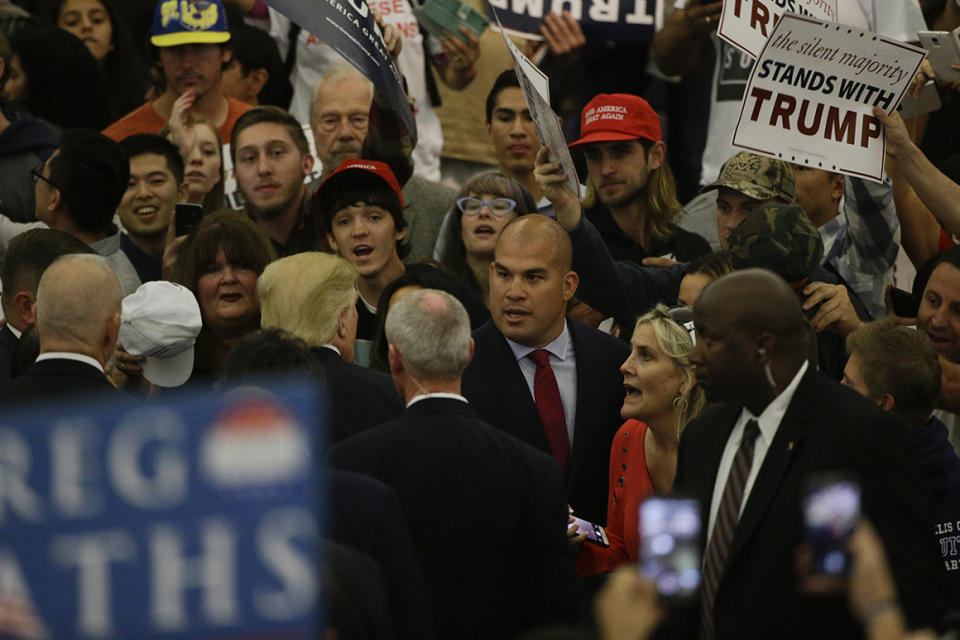 Former MMA fighter Tito Ortiz, center, talks to Republican presidential candidate Donald Trump during a rally at the Anaheim Convention Center, Wednesday, May 25, 2016, in Anaheim, Calif. (AP Photo/Jae C. Hong)
