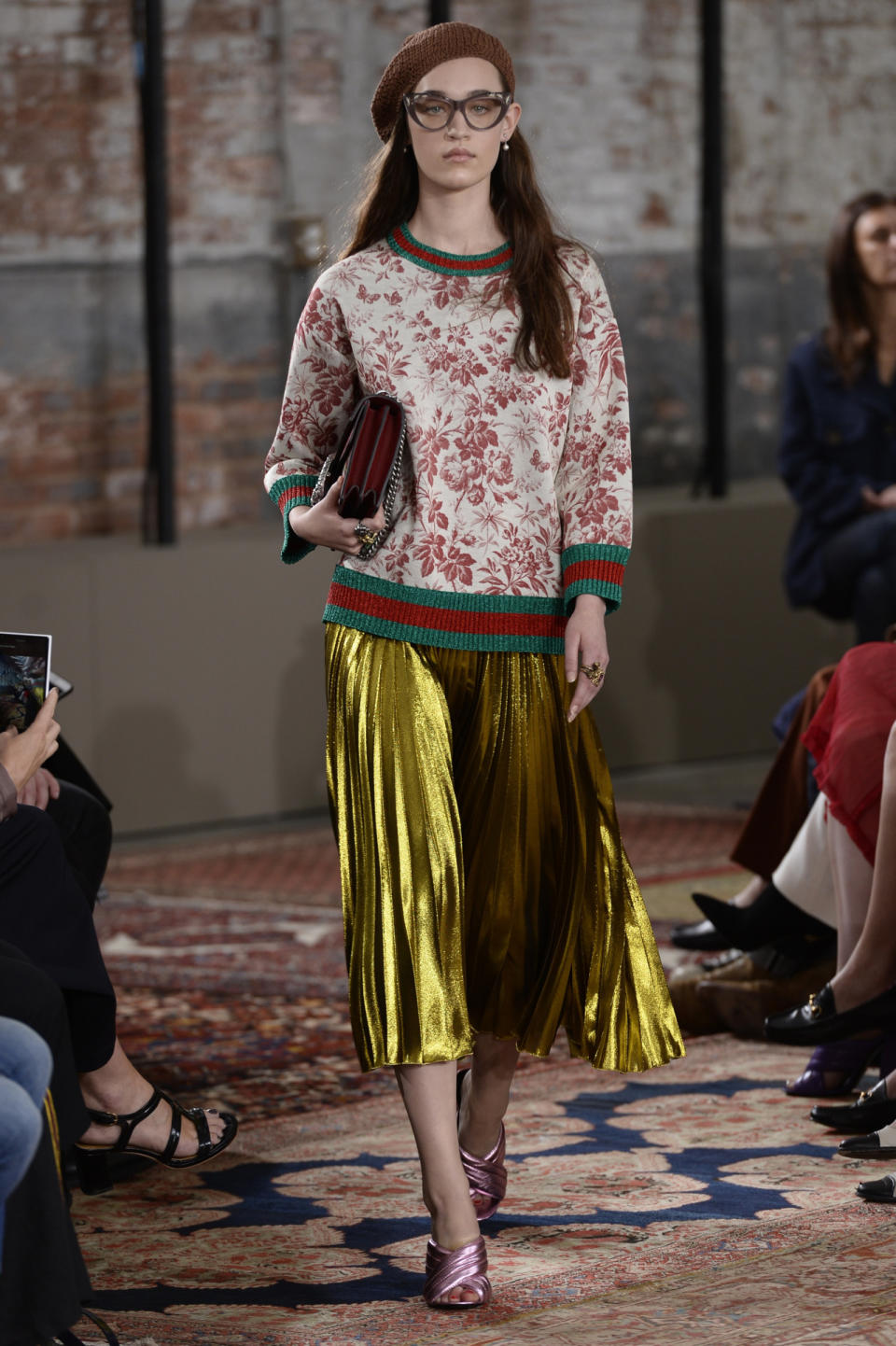 Floral sweatshirt and yellow lam? skirt from the Gucci Resort show.