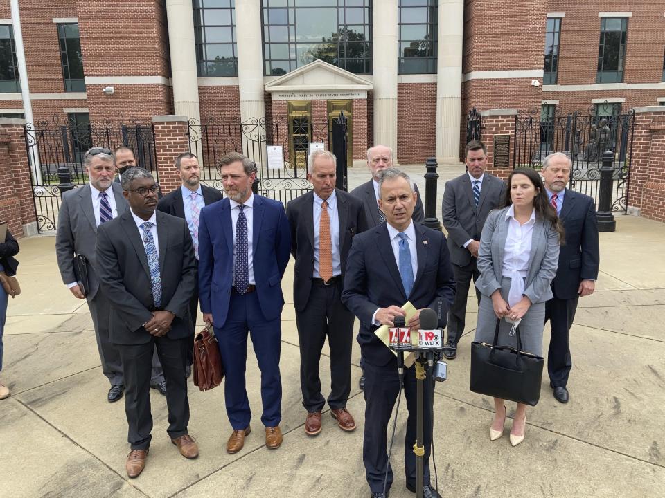 Federal prosecutors and investigators speak about a pair of nuclear reactors in South Carolina that were never finished during a news conference Thursday, Oct. 7, 2021 in Columbia, S.C. An executive who spent billions of dollars on two South Carolina nuclear plants that never generated a watt of power, lying and deceiving regulators about their progress, is ready to go to prison. Former SCANA Corp. CEO Kevin Marsh has agreed with prosecutors that he should spend two years in prison. He goes before a federal judge Thursday who will decide whether to accept that deal. (AP Photo/Jeffrey Collins)