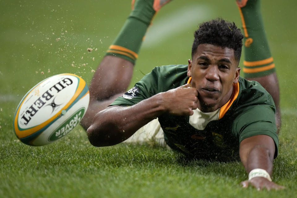 FILE - South Africa's Canan Moodie scores a try against Australia during their Championship Rugby test match in Sydney, on Sept. 3, 2022. This Rugby World Cup was always the ultimate goal for the Springboks coaching combination of Rassie Erasmus and Jacques Nienaber, who sat down soon after taking over a struggling team in early 2018 and began plotting a five-year plan to build a squad for France 2023. (AP Photo/Rick Rycroft, File)