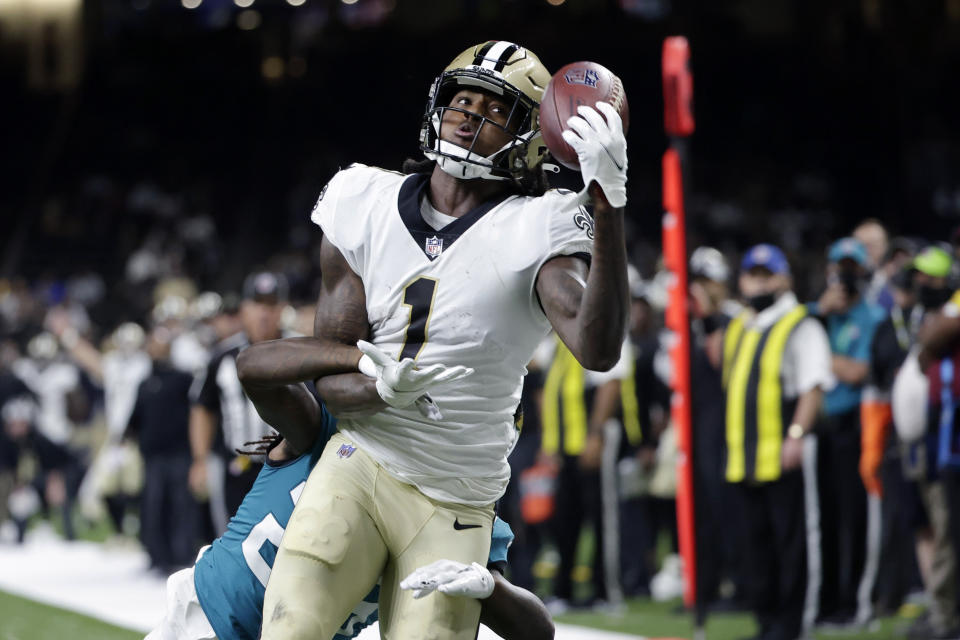 New Orleans Saints wide receiver Marquez Callaway (1) pulls in a one handed touchdown reception over Jacksonville Jaguars cornerback Shaquill Griffin in the first half of an NFL preseason football game in New Orleans, Monday, Aug. 23, 2021. (AP Photo/Derick Hingle)