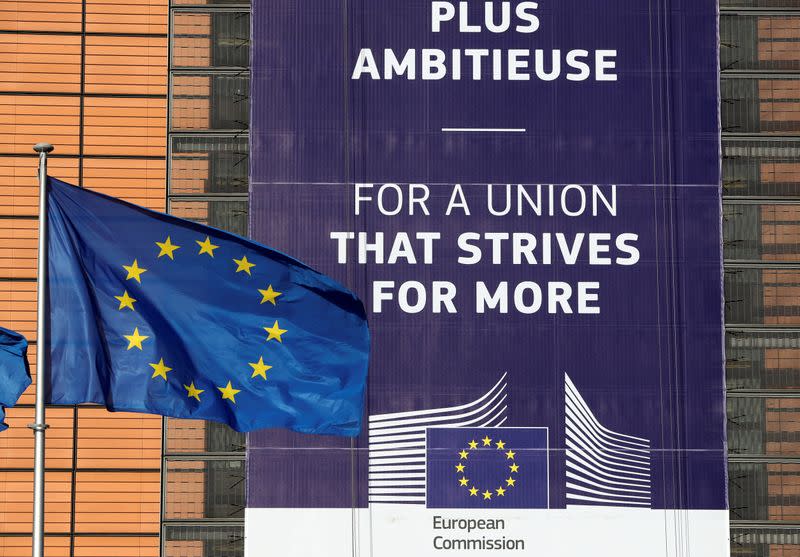 FILE PHOTO: European Union flags fly outside the European Commission headquarters in Brussels