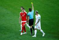 Soccer Football - World Cup - Group E - Serbia vs Switzerland - Kaliningrad Stadium, Kaliningrad, Russia - June 22, 2018 Serbia's Sergej Milinkovic-Savic is shown a yellow card by referee Felix Brych REUTERS/Fabrizio Bensch