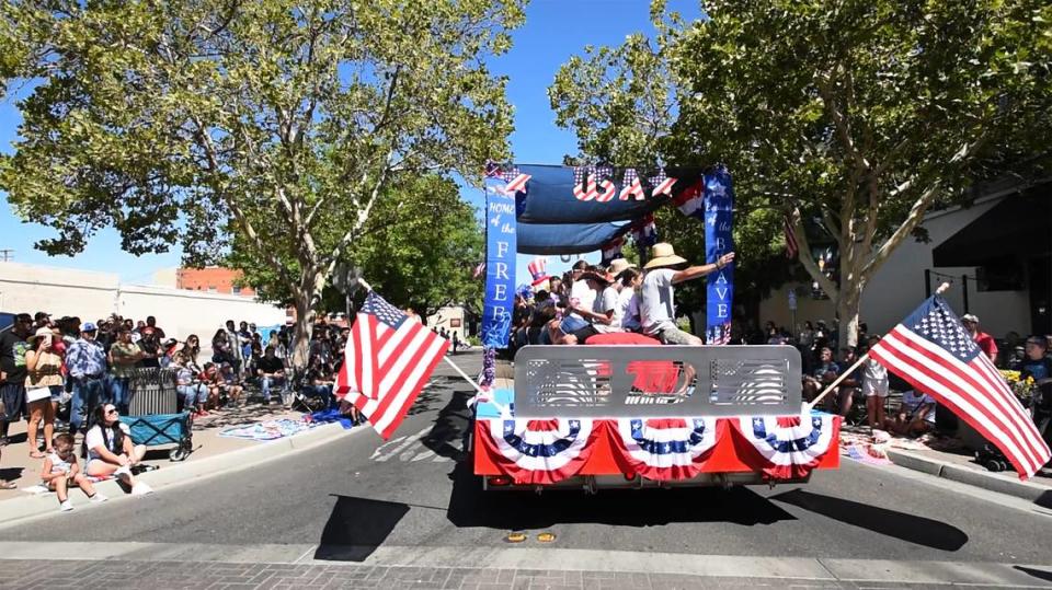 Turlock Irrigation District’s float passes by the crowd during the downtown 4th of July parade in Turlock Calif., on Saturday, July 2, 2022.