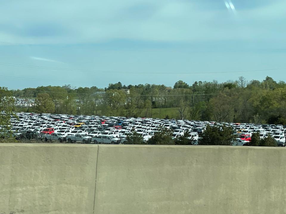 Thousands of pickup trucks could be seen from Interstate 71 in Sparta, Ky., on Sunday. Ford Motor Co. had approximately 22,000 vehicles at the end of March primarily in North America awaiting installation of chip-related components, Chief Financial Officer John Lawler said during a first-quarter earnings call with analysts on April 28, 2021.