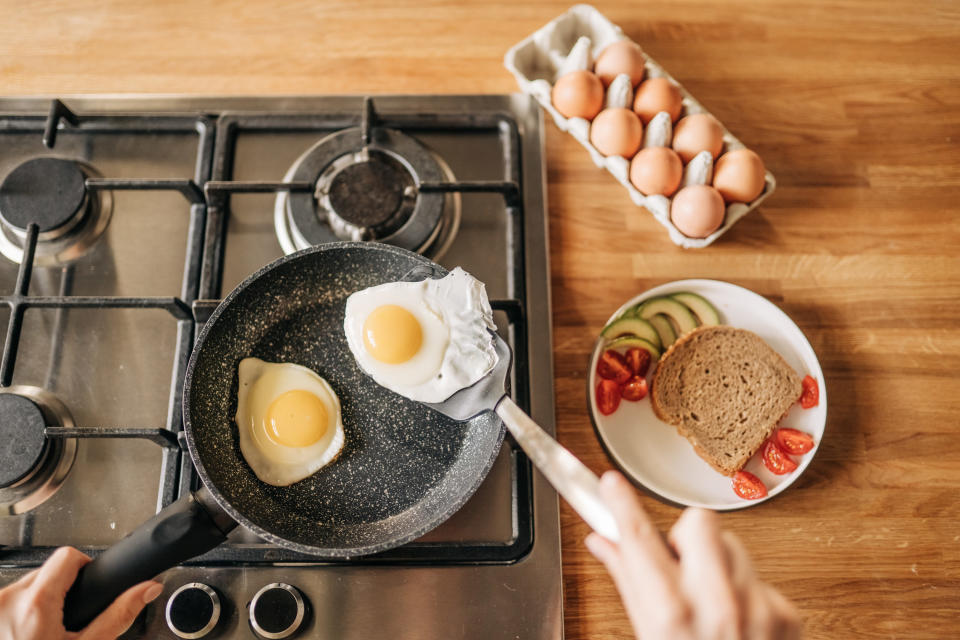 A person making eggs