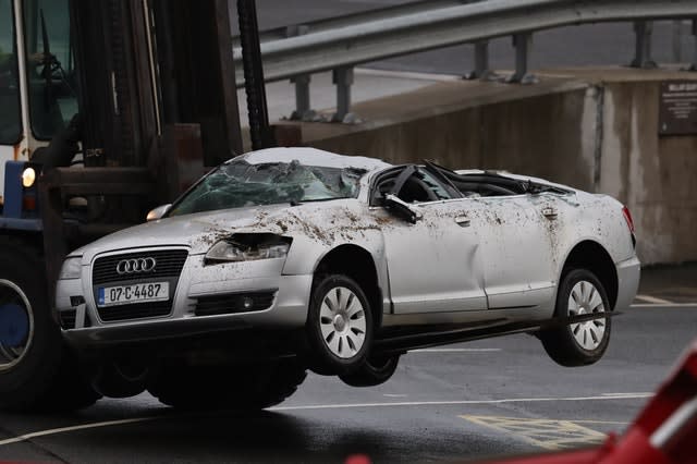 Crushed car lifted off ferry