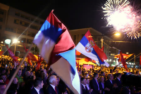 Supporters of the Alliance of Independent Social Democrats (SNSD) celebrate the results of a referendum over a disputed national holiday during an election rally in Pale, Bosnia and Herzegovina, September 25, 2016. REUTERS/Dado Ruvic