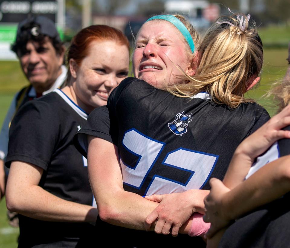 Lakeland Christian's KJ Straub receives a hug from Paiton Carroll (22) after the Vikings defeated Shorecrest Prep in the finals of the 2024 FHSAA Class 2A Girls Soccer Finals at the Lake Myrtle Soccer Complex in Auburndale.