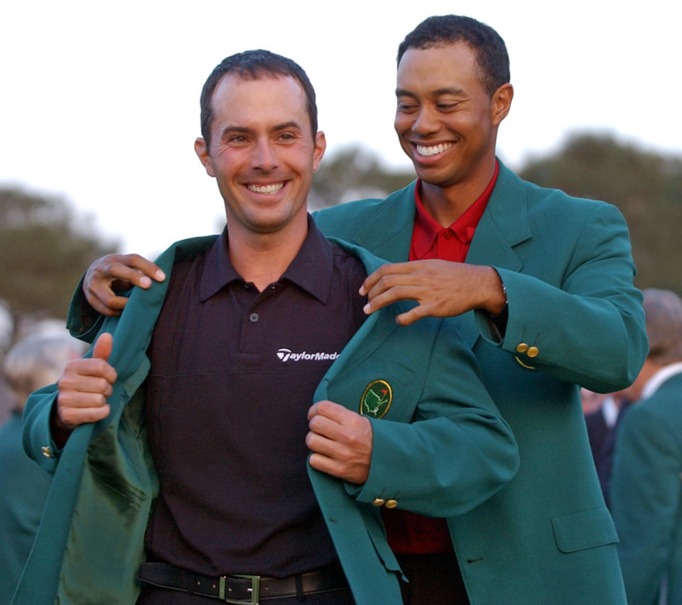 <p>2002 champion Tiger Woods, right, helps Mike Weir don the traditional green jacket after the Canadian won the 2003 Masters, at the Augusta National Golf Club in Augusta, Ga., April 13, 2003. (AP Photo/Elise Amendola) </p>