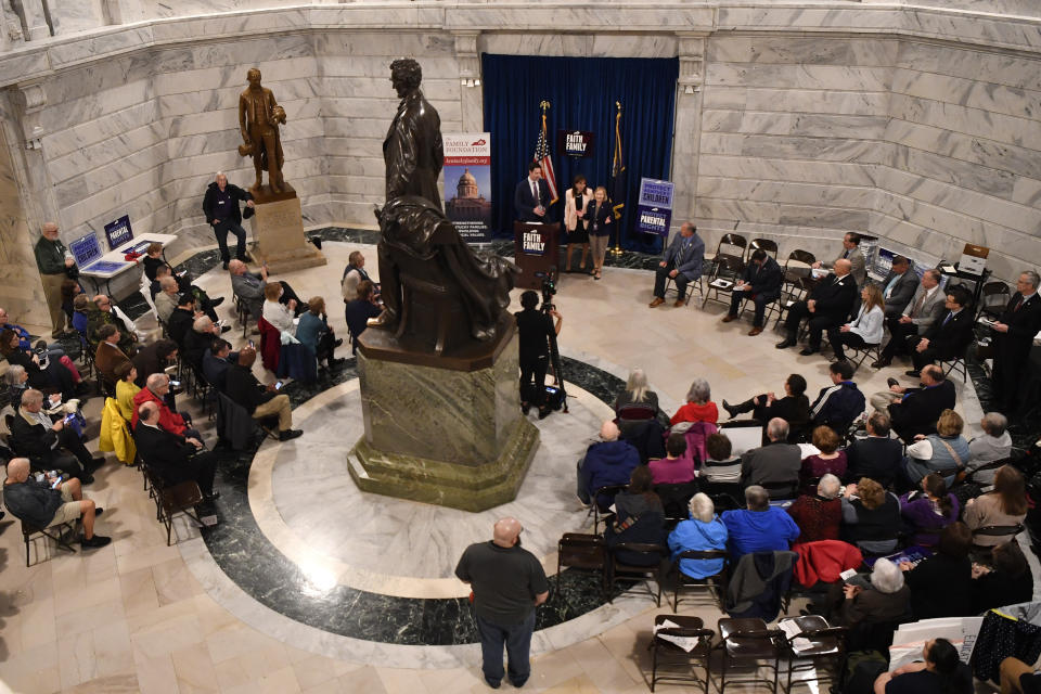 Members of the Faith and Family advocacy group, a pro life organization, hold a rally in the rotunda of the Kentucky State Capitol in Frankfort, Ky., Thursday, Feb. 16, 2023. The Kentucky Supreme Court on Thursday refused to allow abortions to resume in the state, rejecting a request to halt a near total ban of the procedure. (AP Photo/Timothy D. Easley)