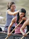 <p> Smiling while rowing on the River Thames in London. </p>