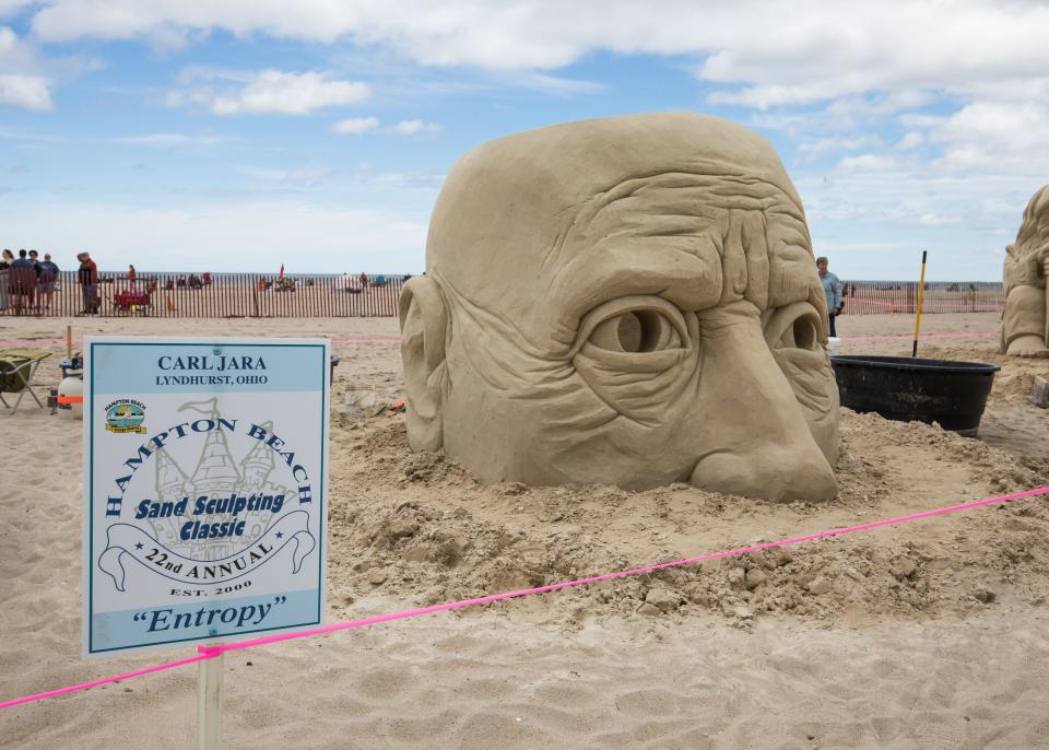 Carl Jara, of Lyndhurst, Ohio, created "Entropy." Jara's sculpture was about his dad who has dementia. It was a sculpture of a man's head, hollow inside with picture frames of family memories for the 2022 Hampton Beach Master Sand Sculpting Classic, which concluded Saturday, June 18.