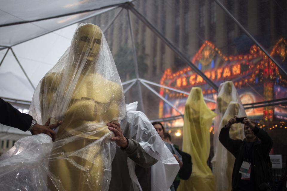 A covered Oscars statue is moved along the red carpet ahead of the 86th Academy Awards in Hollywood, California