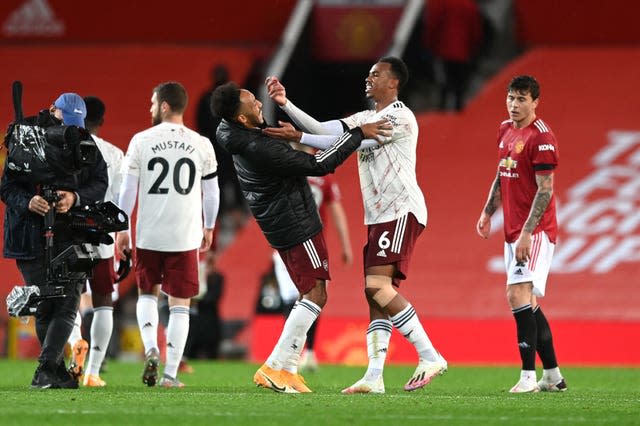 Arsenal captain Pierre-Emerick Aubameyang, left, shares a joke with team-mate Gabriel Magalhaes following a 1-0 victory over Manchester United. Despite winning at Old Trafford at the start of November, the Gunners had a season to forget. Having signed a new contract last summer, Aubameyang was unable to consistently replicate the red-hot form shown in 2019-20, with his struggles epitomising the club's