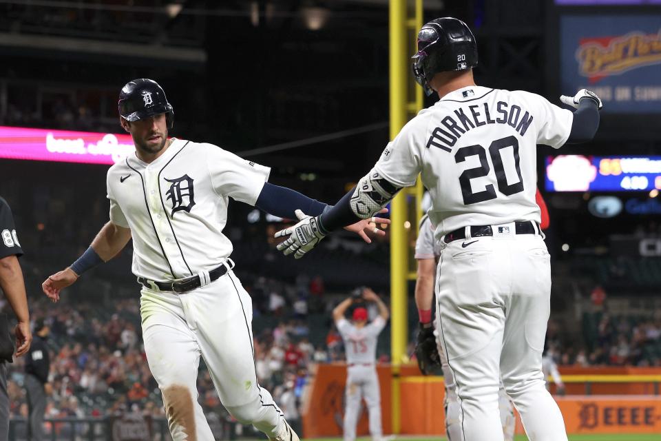 Tigers left fielder Matt Vierling celebrates scoring a run in the fifth inning with first baseman Spencer Torkelson on Tuesday, Sept. 12, 2023, at Comerica Park.