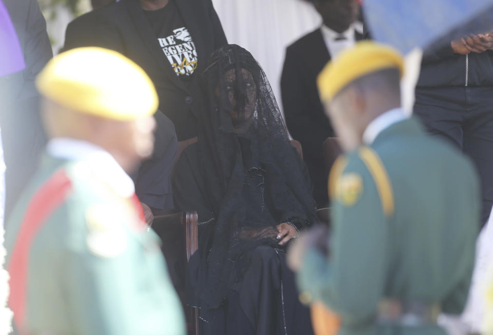 Grace Mugabe, widow of former Zimbabwean President Robert Mugabe, looks on during mass at his rural home in Zvimba, about 100 kilometers north west of the capital Harare, Saturday. Sept, 28, 2019. According to a family spokesperson Mugabe is expected to be buried at the residence after weeks of drama mystery and contention over his burial place. (AP Photo/Tsvangirayi Mukwazhi)