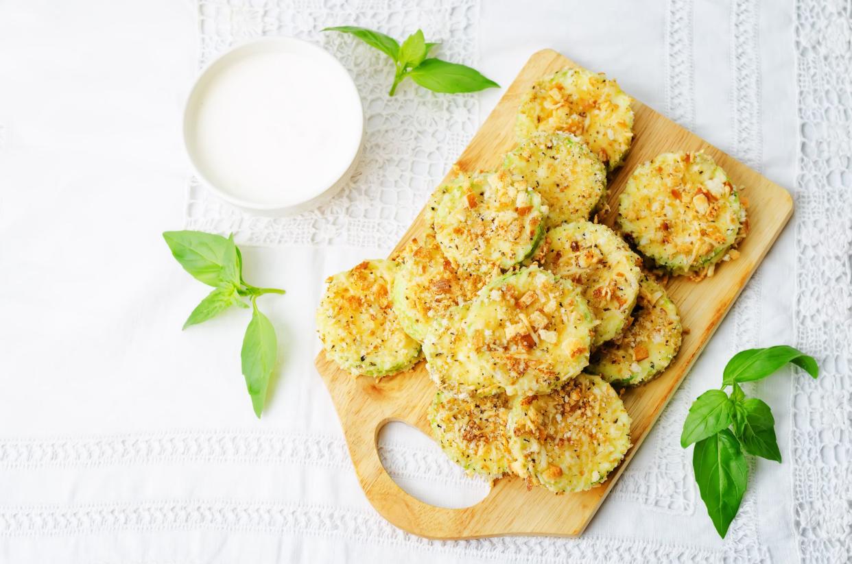 baked parmesan zucchini crisps with cream sauce. the toning. selective focus