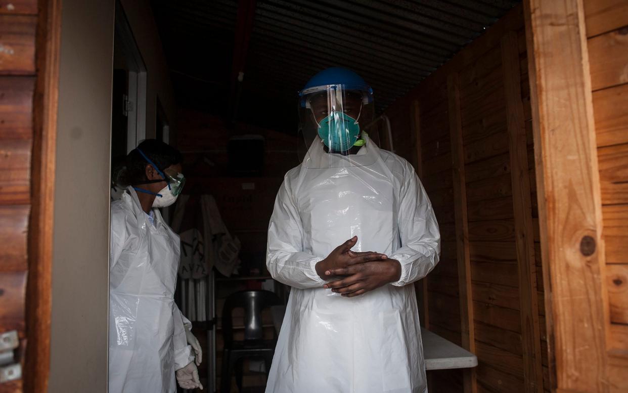 medical workers prepare to test people for COVID-19 in a mobile testing unit in Yeoville, Johannesburg's. South Africa, one of the world's most unequal countries - AP