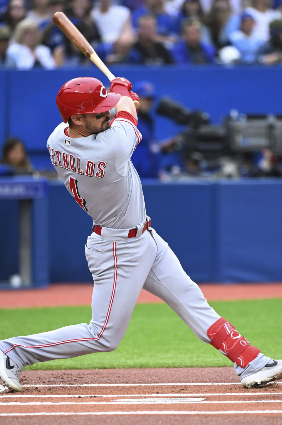 Cincinnati Reds' Matt Reynods follows through on a single against the Toronto Blue Jays during the first inning of a baseball game Friday, May 20, 2022, in Toronto. (Jon Blacker/The Canadian Press via AP)