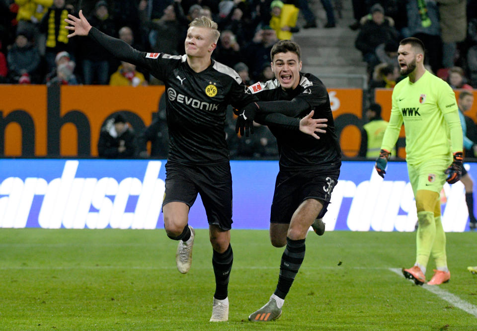 Erling Haaland (left) scored three times in 20 minutes and U.S. youth international Gio Reyna also made his Borussia Dortmund debut in Saturday's victory. (Photo by Stefan Puchner/picture alliance via Getty Images)