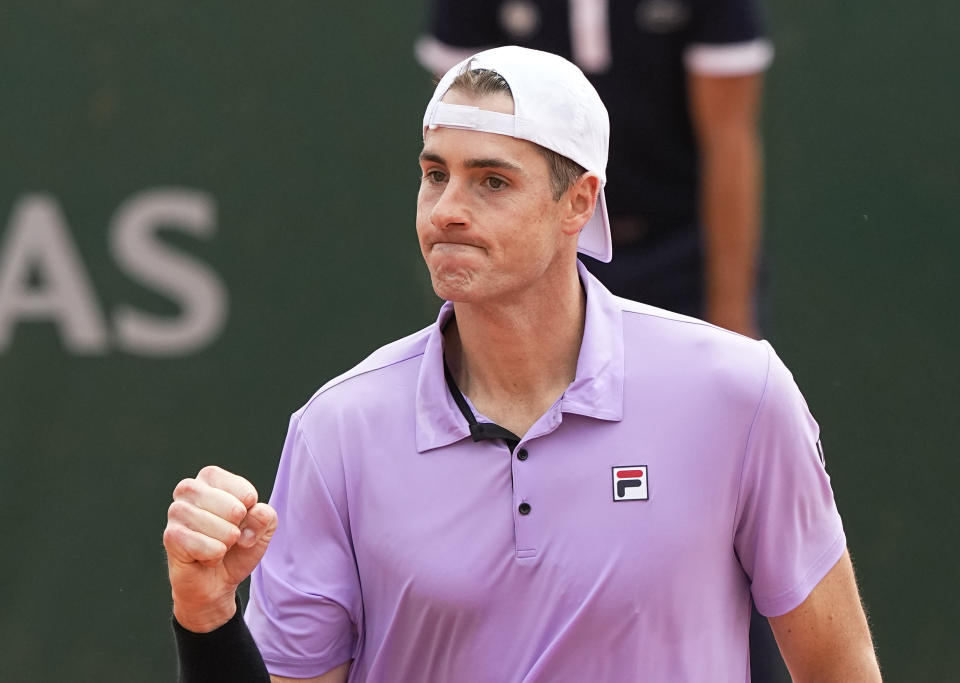 United States' John Isner celebrates winning a point against Serbia's Filip Krajinovic during their second round match on day four of the French Open tennis tournament at Roland Garros in Paris, France, Wednesday, June 2, 2021. (AP Photo/Michel Euler)