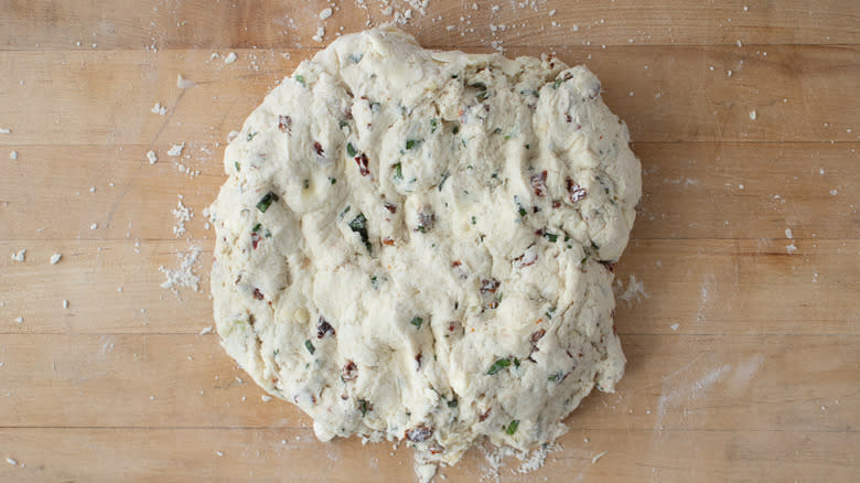 cookie dough kneaded on wooden board