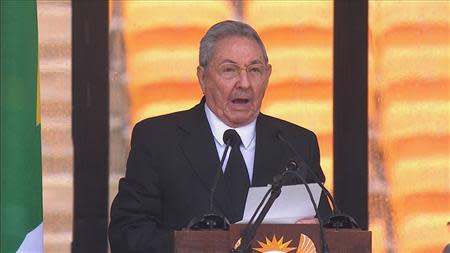 Cuban President Raul Castro makes a speech in this still image taken from video courtesy of the South Africa Broadcasting Corporation (SABC) at the First National Bank (FNB) Stadium, also known as Soccer City, during former South African President Nelson Mandela's national memorial service in Johannesburg December 10, 2013. REUTERS/SABC via Reuters TV