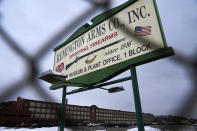 A sign for Remington Arms Co. is displayed in front of their compound in Ilion, N.Y., Thursday, Feb. 1, 2024. The nation’s oldest gun-maker is consolidating operations in Georgia and recently announced plans to shutter the Ilion factory in early March. (AP Photo/Seth Wenig)