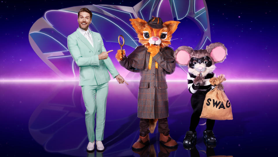 This image and the information contained herein is strictly embargoed until 20.00 Sunday 18th December 2022

From Bandicoot TV

The Masked Singer: SR4 on ITV1 and ITVX

Pictured: Joel Dommett and Cat & Mouse.

This photograph is (C) ITV Plc/Bandicoot TV and can only be reproduced for editorial purposes directly in connection with the programme or event mentioned above, or ITV plc. Once made available by ITV plc Picture Desk, this photograph can be reproduced once only up until the transmission [TX] date and no reproduction fee will be charged. Any subsequent usage may incur a fee. This photograph must not be manipulated [excluding basic cropping] in a manner which alters the visual appearance of the person photographed deemed detrimental or inappropriate by ITV plc Picture Desk.  This photograph must not be syndicated to any other company, publication or website, or permanently archived, without the express written permission of ITV Picture Desk. Full Terms and conditions are available on the website www.itv.com/presscentre/itvpictures/terms

For further information please contact:
james.hilder@itv.com