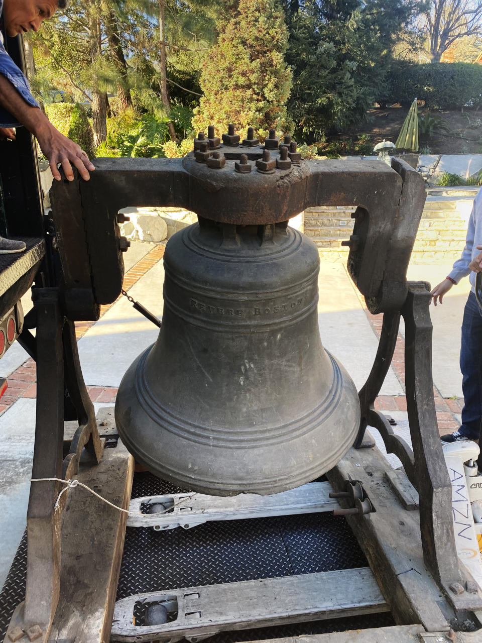 In this handout photograph provided by Amy Miller, a bronze bell forged in 1834 by Paul Revere's son, Joseph Warren Revere, is loaded on a forklift in Chino Hills, Calif., on Feb. 8, 2022, for transport to the Paul Revere Heritage Site in Canton, Massachusetts. Amy Miller, the daughter of the California couple who acquired the bell in 1984, says she and her brother donated it to the museum so the public could view and appreciate it. (Amy Miller photo via AP)