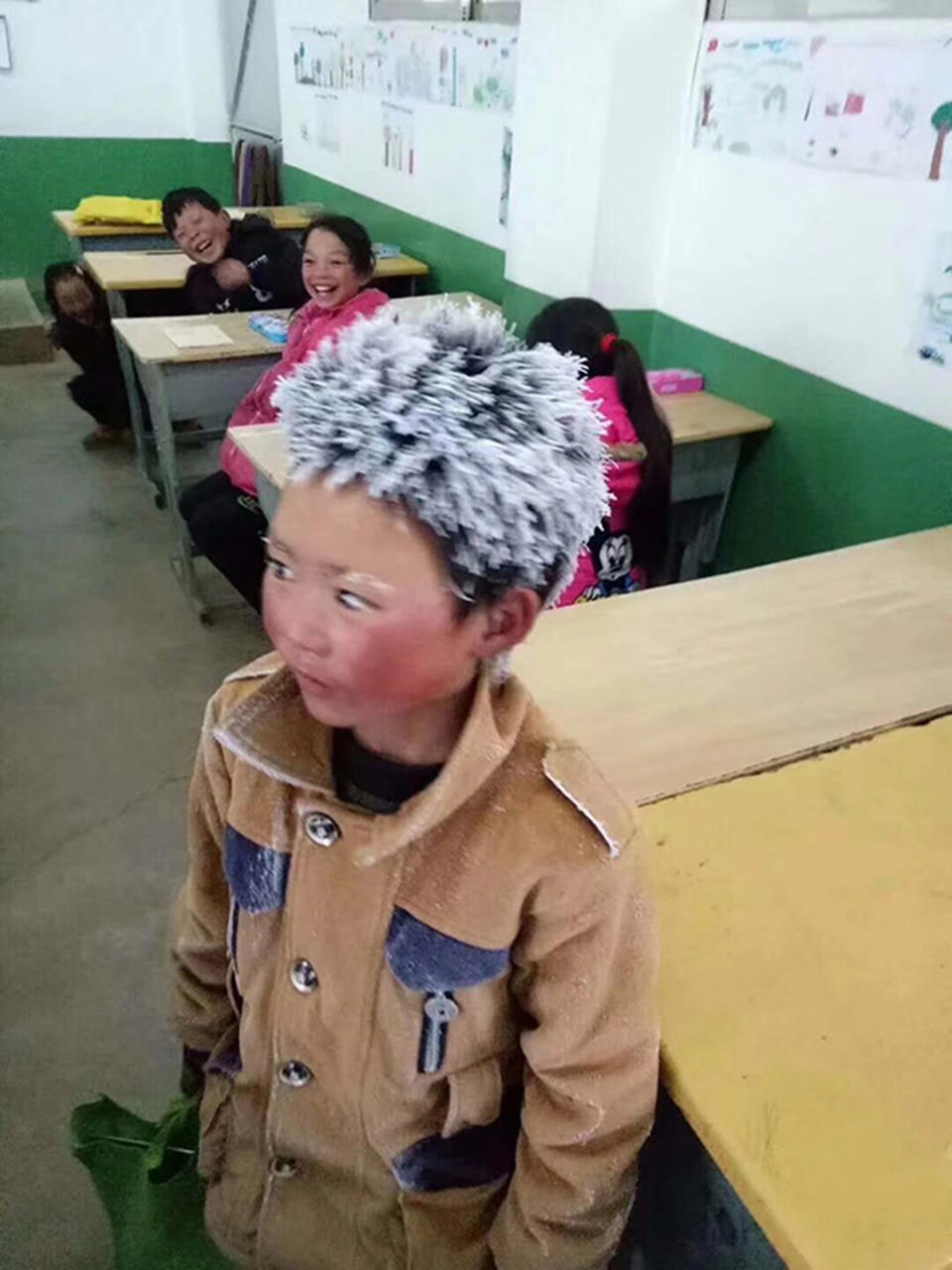 The boy, 10, walked three miles to school in freezing temperatures (Picture: Asia Wire)