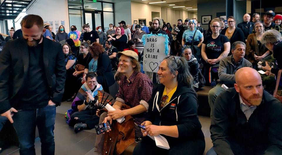 Emerald of Siam owner Dara Quinn, center, and about 150 supporters fill Richland City Hall after marching to the council meeting from the restaurant to address the council about their concerns.