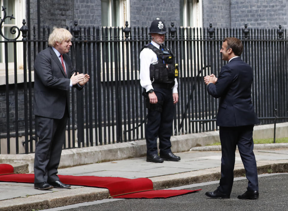 British Prime Minister Boris Johnson, left, meets with French President Emmanuel Macron at 10 Downing Street in London, Thursday, June 18, 2020. The President of the French Republic visits London to celebrate the 80th Anniversary of General de Gaulle's 'Appel' to the French population to resist the German occupation of France during WWII. (AP Photo/Alastair Grant)