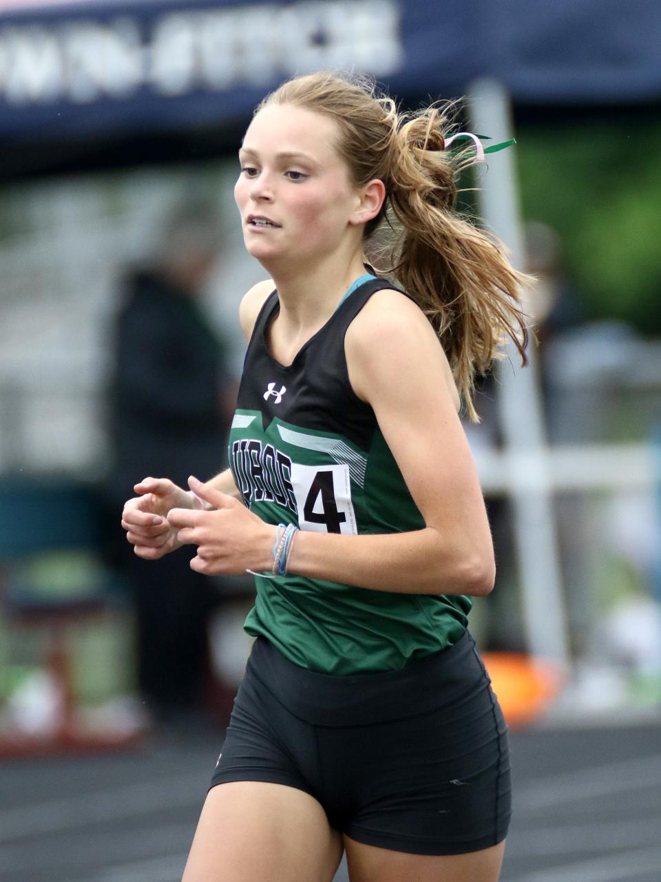 Aurora's Morgan Schmitt competes in the girls 1600-meter final during the Division I regional final track and field meet at Austintown High School, Friday, May 27, 2022.