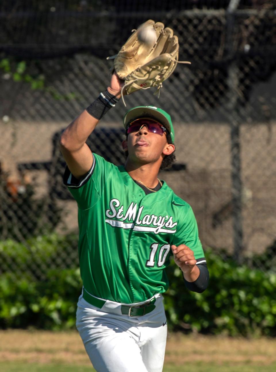 St.Mary's Quedens catches a fly ball during a Sac-Joaquin Section playoff game against Folsom at St. Mary's in Stockton on Thursday, May 11, 2023.  St. Mary's won 6-1.