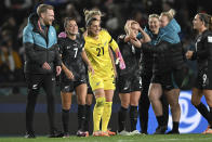 New Zealand's Ali Riley, second left, celebrates with New Zealand's goalkeeper Victoria Esson at the end of the Women's World Cup soccer match between New Zealand and Norway in Auckland, New Zealand, Thursday, July 20, 2023. New Zealand won the match 1-0. (AP Photo/Andrew Cornaga)