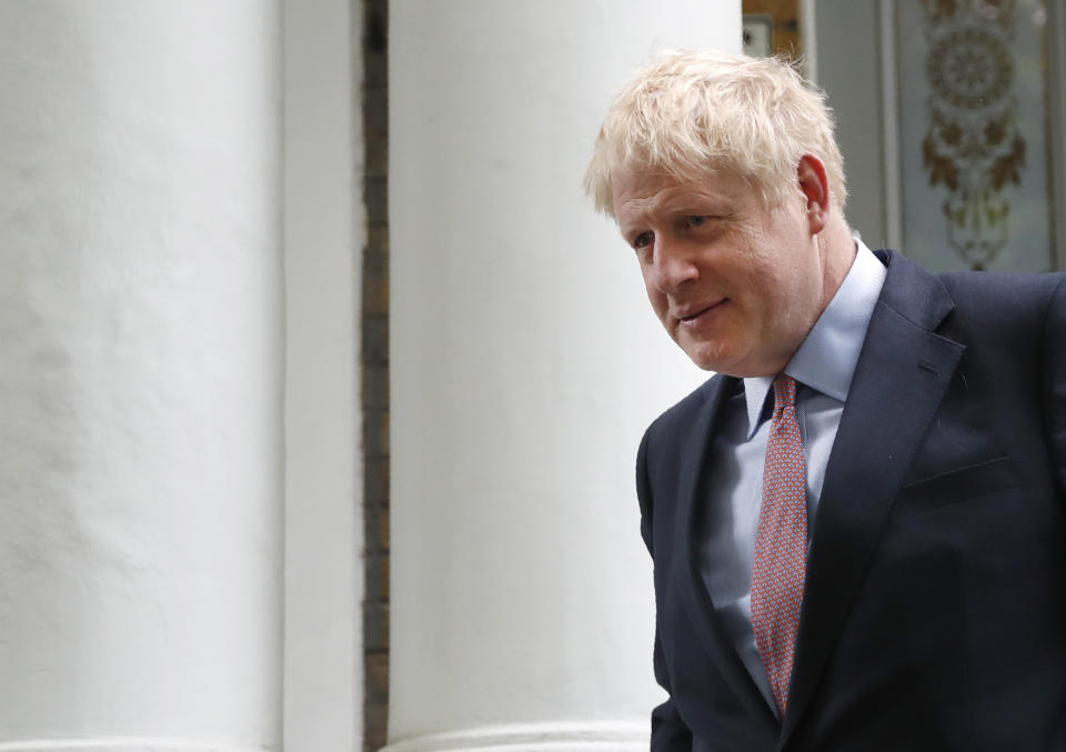 British Conservative party lawmaker Boris Johnson leaves home in south London, Friday, June 14, 2019.  Johnson is a leading candidate in the Conservative Party leadership campaign to be the next British Prime Minister. (AP Photo/Alastair Grant)