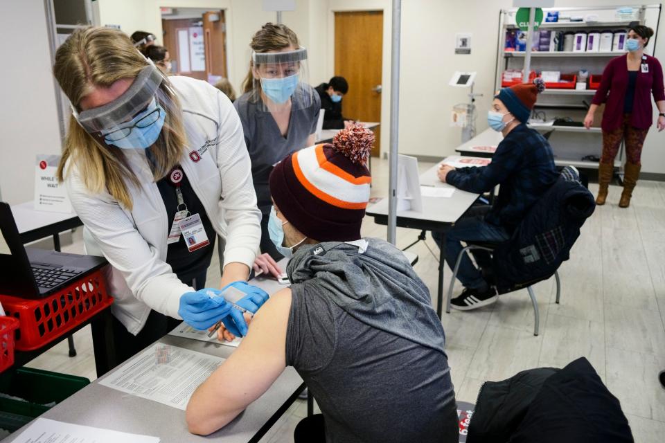 Healthcare workers get their vaccine doses in Ohio.