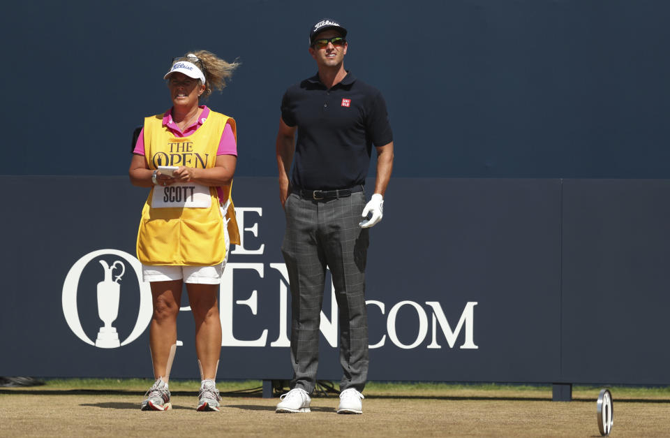 FILE - Adam Scott of Australia stands on the 1st tee box with his caddie Fanny Sunesson during the final round of the British Open Golf Championship in Carnoustie, Scotland, Sunday July 22, 2018. Sunesson began her caddying career in Sweden. The other two girls working that week as caddies were Annika Sorenstam and her sister Charlotta Sorenstam. (AP Photo/Jon Super, File)