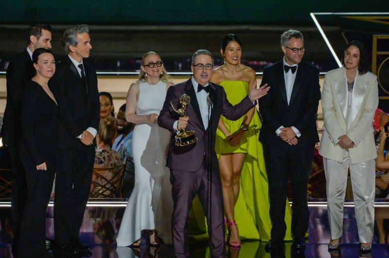 John Oliver accepts an Emmy for "Last Week Tonight" with the staff on stage behind him. File Photo by Mike Goulding/UPI