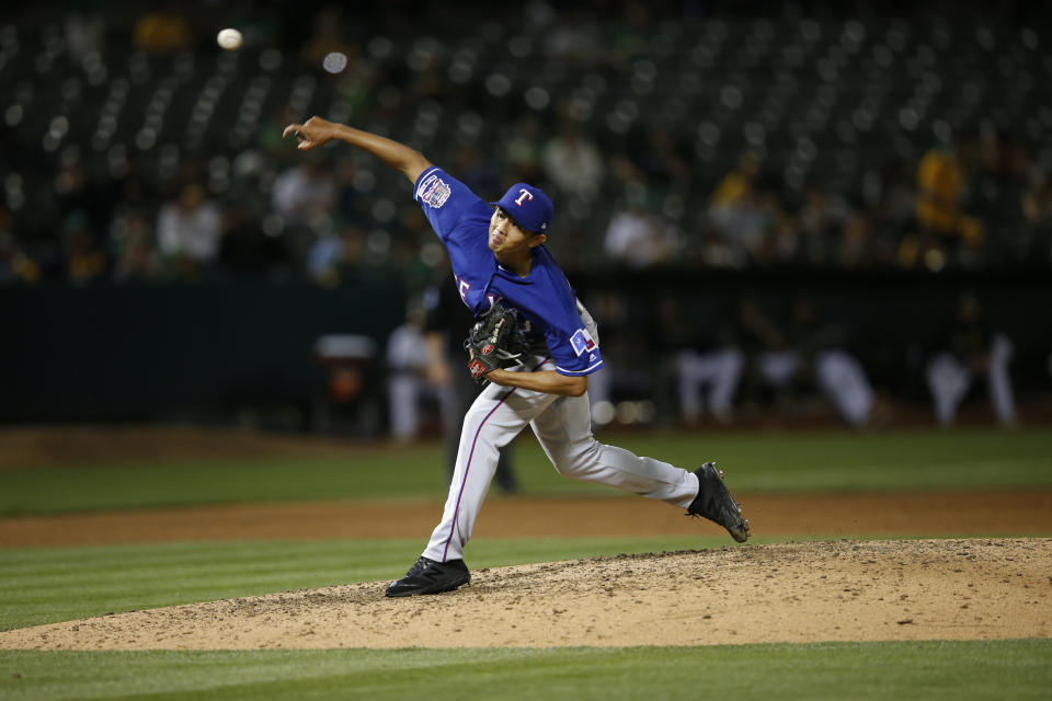 OAKLAND, CA - APRIL 23: Wei-Chieh Huang #68 of the Texas Rangers pitches during the game against the Oakland Athletics at the Oakland-Alameda County Coliseum on April 23, 2019 in Oakland, California. The Athletics defeated the Rangers 11-5. (Photo by Michael Zagaris/Oakland Athletics/Getty Images)