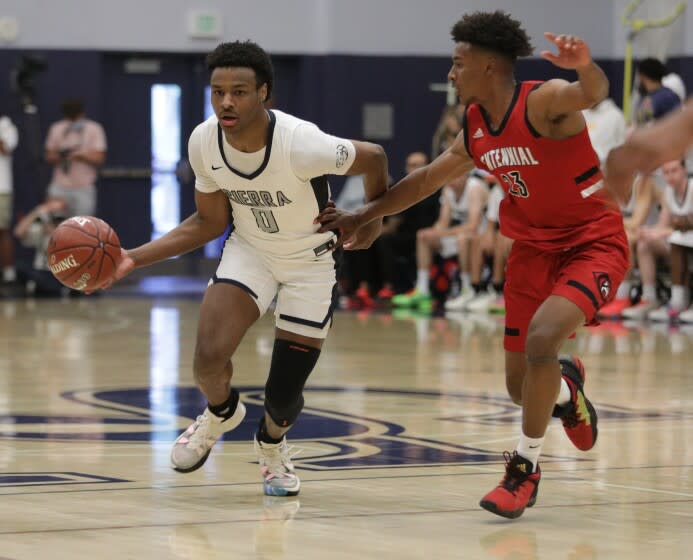 Sierra Canyon's Bronny James moves the ball up the court against Corona Centennial's Ramsey Huff.