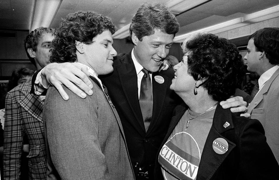 Arkansas Governor Bill Clinton, center, celebrates his re-election with his mother, Virginia Kelley, right, and brother, Roger Clinton, left, at Clinton campaign headquarters in Little Rock, Ark., on Nov. 6, 1984.