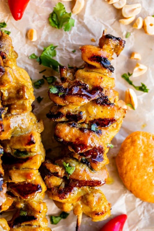 <p>The Food Charlatan</p><p>Marinated chicken thighs seasoned with lemongrass, shallot, and chili are threaded onto skewers and grilled to juicy perfection.</p><p><strong>Get the recipe: <a href="https://thefoodcharlatan.com/thai-chicken-satay/" rel="nofollow noopener" target="_blank" data-ylk="slk:Grilled Thai Chicken Satay Skewers;elm:context_link;itc:0;sec:content-canvas" class="link "><em>Grilled Thai Chicken Satay Skewers</em></a></strong></p>